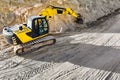 Aerial view of excavator working in quarry or construction site. Industrial top view background concept. A mining excavator is Royalty Free Stock Photo