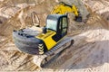 Aerial view of excavator working in quarry or construction site. Industrial top view background concept. A mining excavator is Royalty Free Stock Photo