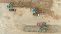 Aerial View of Excavators Loading Dump Trucks at Construction Site Royalty Free Stock Photo