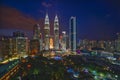 Majestic view of Petronas Twin Towers during blue hour sunset with dramatic sky. Petronas Twin Towers is the tallest building in M Royalty Free Stock Photo