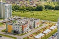 Aerial view exterior public housing HDB resident buildings, new multistory flats complex with grass courtyard, trees