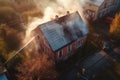 Aerial view of extinguish burning house roof, emergency Royalty Free Stock Photo