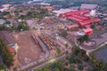 Aerial view of factory industry with smoke and toxic air from chimney in energy and pollution environment concept with city town