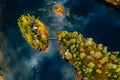 Aerial view of fall autumn colors forest and blue lake with island in rural Finland Royalty Free Stock Photo