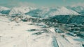 Aerial view of famous crowded Alpe d'Huez ski resort on a winter sunny day, France