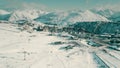 Aerial view of famous crowded Alpe d'Huez ski resort on a winter sunny day, France