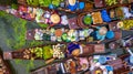 Aerial view famous floating market in Thailand, Damnoen Saduak floating market, Farmer go to sell organic products, fruits, Royalty Free Stock Photo