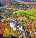 Aerial view of famous Neuschwanstein Castle in autumn Royalty Free Stock Photo