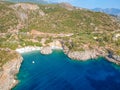 Aerial view of the famous rocky beach Foneas near Kardamyli village in the seaside Messenian Mani area during high tourist Summer Royalty Free Stock Photo