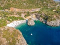 Aerial view of the famous rocky beach Foneas near Kardamyli village in the seaside Messenian Mani area during high tourist Summer Royalty Free Stock Photo