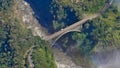 Aerial view of famous Victoria Falls Bridge, marking the border of Simbabwe and Sambia (Africa), over Sambesi River. Royalty Free Stock Photo