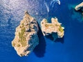 Aerial view of Faraglioni, Capri. Italian coastline in summer season, downward view