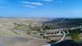 Aerial view of farm field hills, terraced valley with massive agricutlure