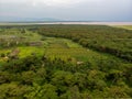 Aerial view on Farm plantation on the Edge with a Primal Virgin Forest of Manyara National Park Concervation Area in Royalty Free Stock Photo