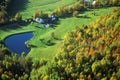 Aerial view of farm with pond near Stowe, VT in autumn on Scenic Route 100 Royalty Free Stock Photo