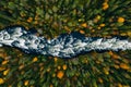 Aerial view of fast blue river flow through fall colorful trees in woods forest Royalty Free Stock Photo