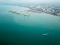 Aerial view ferry carry transport sail pass container terminal.