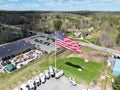 Aerial view of a field in the countryside, with truck and the U.S. flag in the foreground Royalty Free Stock Photo