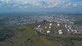 Aerial view of field with trees near the industrial area located outside the city. Clip. Amazing view of factories tanks Royalty Free Stock Photo