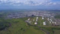 Aerial view of field with trees near the industrial area located outside the city. Clip. Amazing view of factories tanks Royalty Free Stock Photo