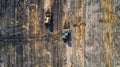 The aerial view of the field undergoing development with the bulldozers. AIG51. Royalty Free Stock Photo