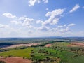 Aerial view of fields of Castile with agricultural plots and blue sky with clouds Royalty Free Stock Photo