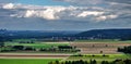 Aerial view of fields. Panorama over fields and nature with beautiful clouds and sky. Agricultural and farm systems concept. Royalty Free Stock Photo