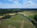 Aerial view of fields and rivers in Hertford with blue sky