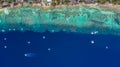 Aerial view of Filipino boats floating on top of clear blue waters, Moalboal is a deep clean blue ocean and has many local Royalty Free Stock Photo