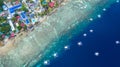 Aerial view of Filipino boats floating on top of clear blue waters, Moalboal is a deep clean blue ocean and has many local Royalty Free Stock Photo