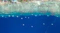 Aerial view of Filipino boats floating on top of clear blue waters, Moalboal is a deep clean blue ocean and has many local Royalty Free Stock Photo