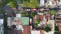 Aerial view of firefighters extinguishing the ruins of a burning furniture factory building with a collapsed roof and billowing Royalty Free Stock Photo