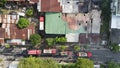 Aerial view of firefighters extinguishing the ruins of a burning furniture factory building with a collapsed roof and billowing Royalty Free Stock Photo