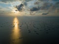 Aerial view fish farm at sea in evening