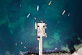 Aerial view of fishermen pier dock with fishing boats in harbour Royalty Free Stock Photo