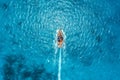 Aerial view of the fishing boat in transparent blue water