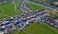 Aerial view on flea market with miscellaneous items and crowds of buyers and seller`s makeshift stands