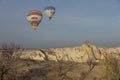 Aerial view of a fleet of hot air balloons, in Cappadocia.