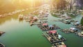 Aerial view of floating fishing village and rock island in Cat Ba island from above. Lan Ha bay. Hai phong, Vietnam