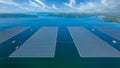 Aerial view floating solar cell power plant with solar cell generate the electric on the lake, Floating solar panels and cell