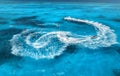 Aerial view of floating water scooter in blue water at sunny day