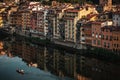 Aerial view of Florence on the Arno river with boat and Reflections of medieval houses