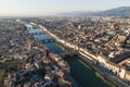 Aerial view of Florence skyline along Arno river at sunset with Ponte Vecchio bridge in foreground, Florence, Tuscany, Italy Royalty Free Stock Photo