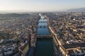 Aerial view of Florence skyline along Arno river at sunset with Ponte Vecchio bridge in foreground, Florence, Tuscany, Italy Royalty Free Stock Photo