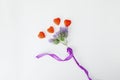 Aerial view of flowers and wavy ribbon knot