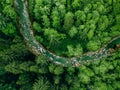 Aerial view of flowing stone river and green woods summer forest Royalty Free Stock Photo