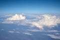 Aerial view of fluffy clouds. Top view of a beautiful cloudscape and blue sky Royalty Free Stock Photo