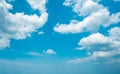 Aerial view fluffy white clouds in blue sky. cumulus cloudscape nature background good weather in bright summer day. copy space of Royalty Free Stock Photo