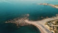 aerial view flying backwards over small rocky Peninsula to reveal the ocean in Kiotari Rhodes Greece