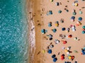 Aerial View From Flying Drone Of People Crowd Relaxing On Algarve Beach Royalty Free Stock Photo